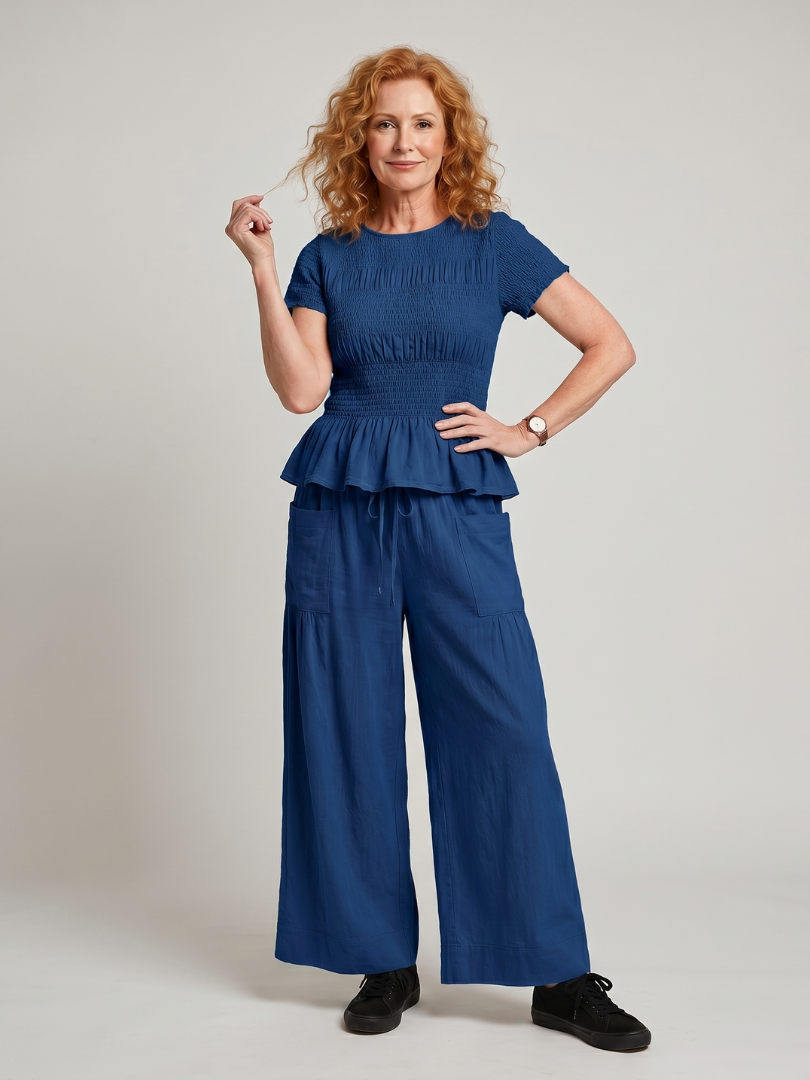 Eirenne | Peplum Detail Smocked Top And Wide Leg Trousers Set