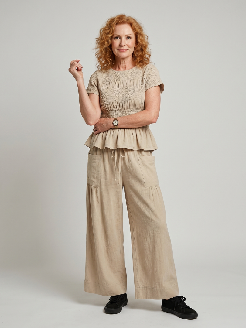 Eirenne | Peplum Detail Smocked Top And Wide Leg Trousers Set