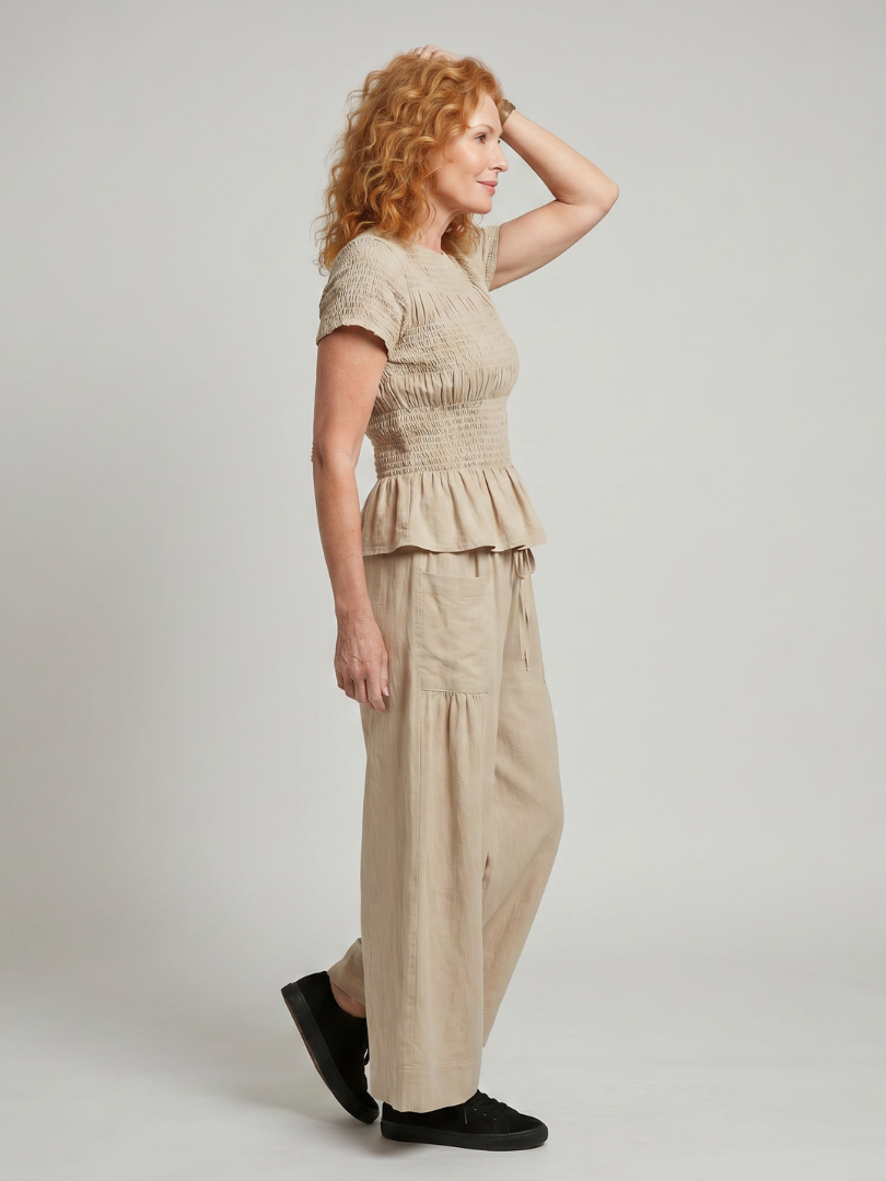 Eirenne | Peplum Detail Smocked Top And Wide Leg Trousers Set