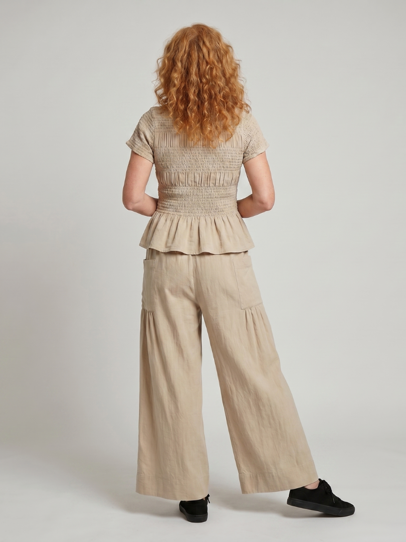 Eirenne | Peplum Detail Smocked Top And Wide Leg Trousers Set