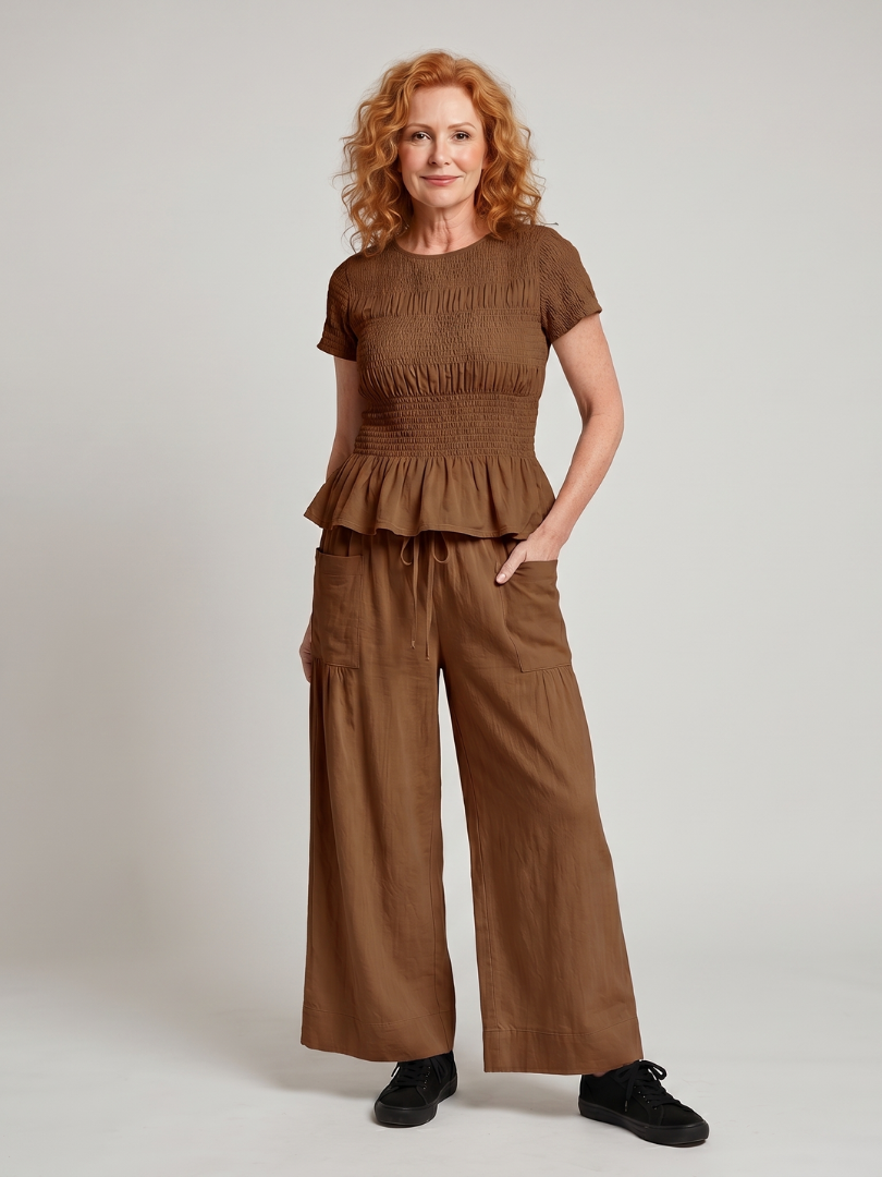 Eirenne | Peplum Detail Smocked Top And Wide Leg Trousers Set