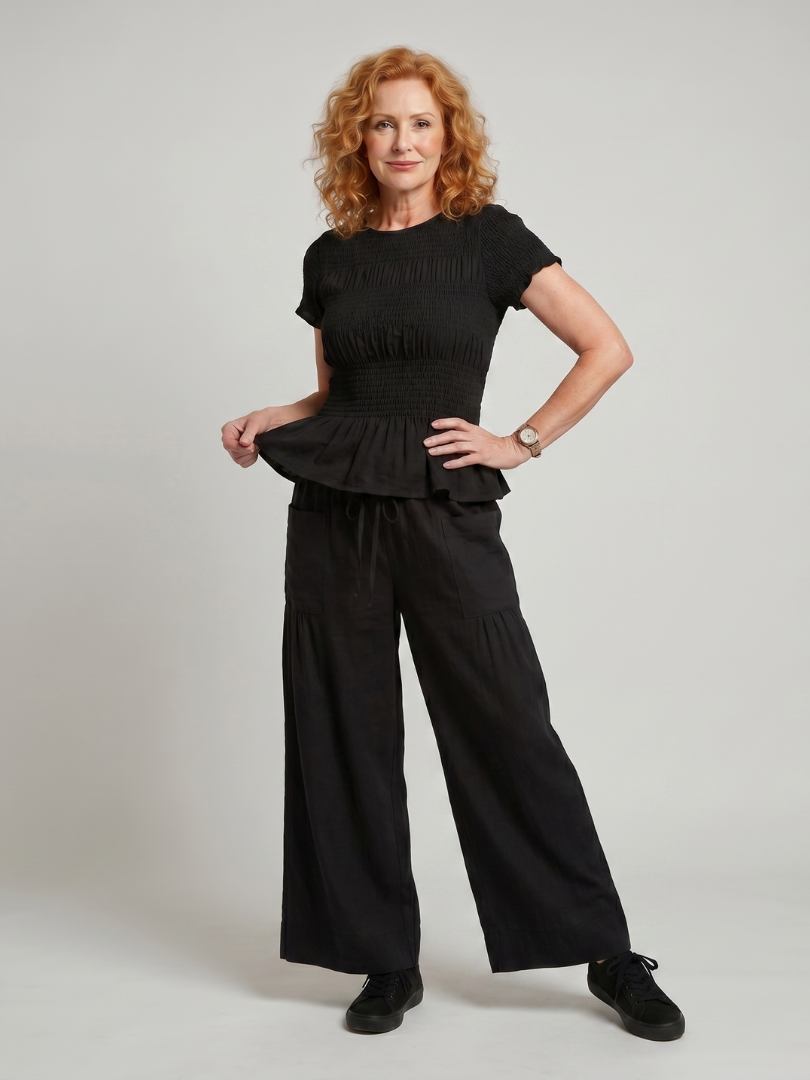 Eirenne | Peplum Detail Smocked Top And Wide Leg Trousers Set